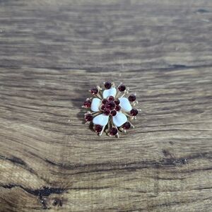 flower brooch with a gold-tone setting